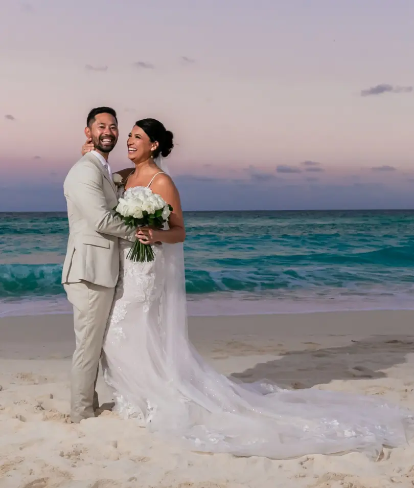 Danielle & Junya's sunset wedding portrait on the beach at Paradisus Cancun