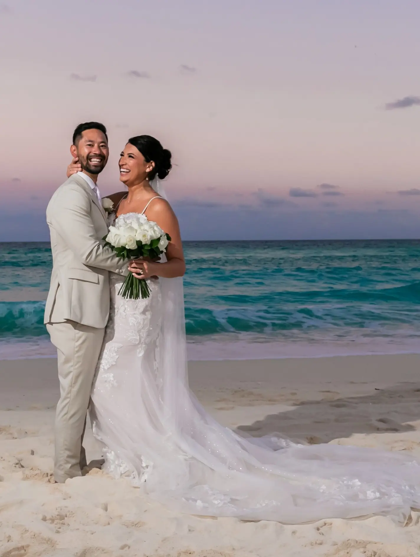 Danielle & Junya's sunset wedding portrait on the beach at Paradisus Cancun