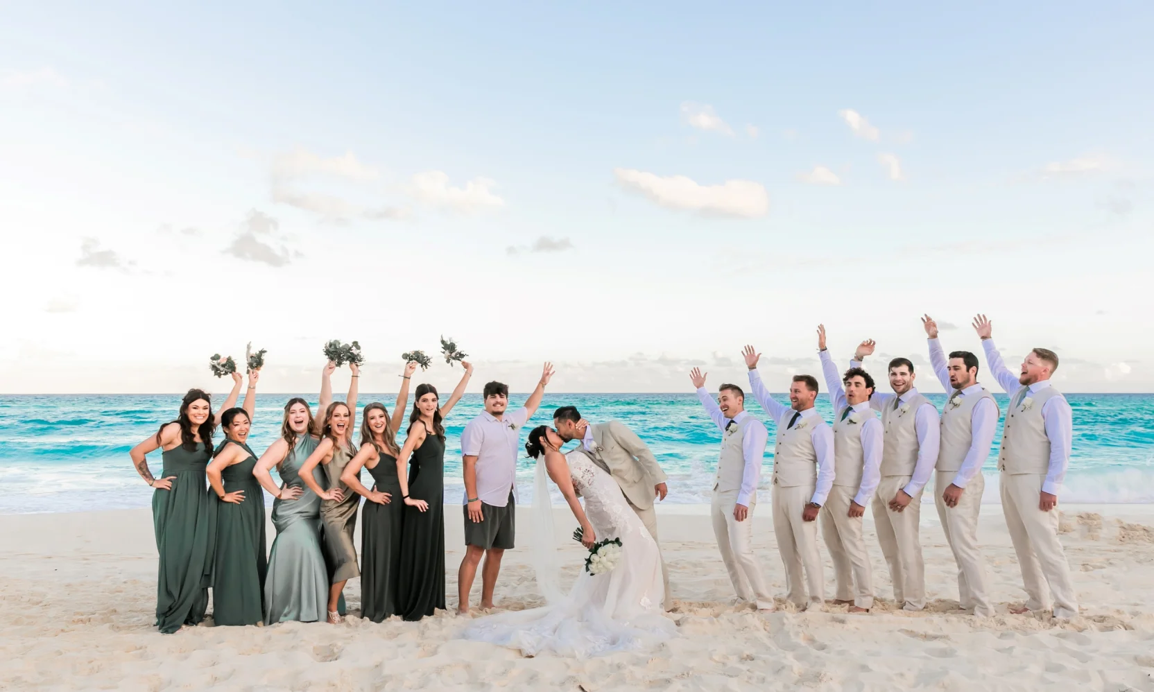 Danielle and Junya on the beach with their wedding party