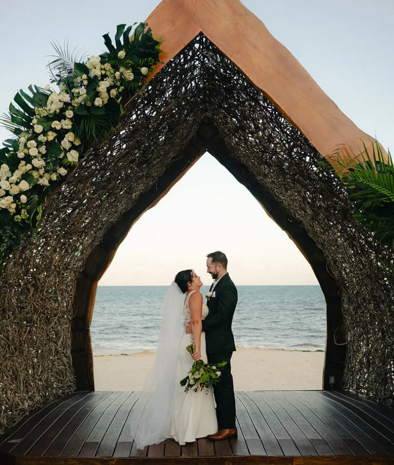 Alexis & Drew's wedding portrait under a gazebo at Dreams Natura, Riviera Maya