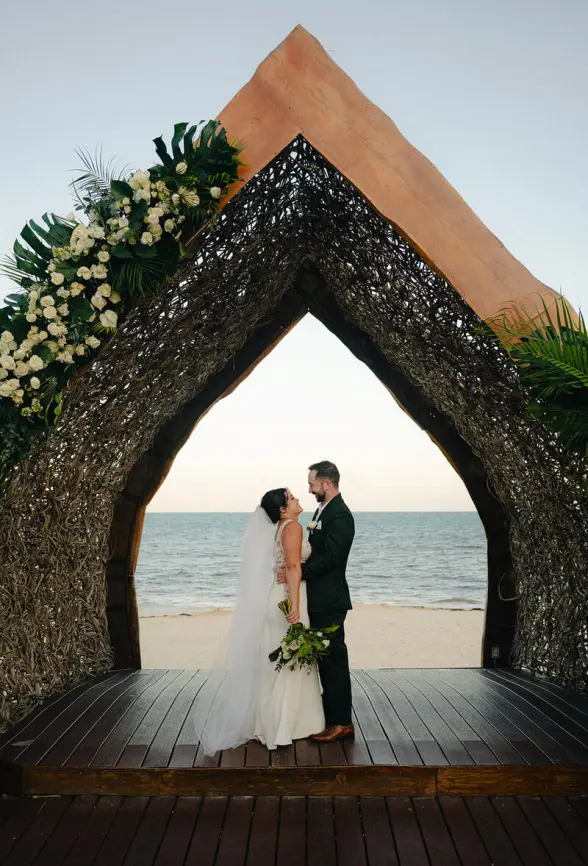 Alexis & Drew's wedding portrait under a gazebo at Dreams Natura, Riviera Maya