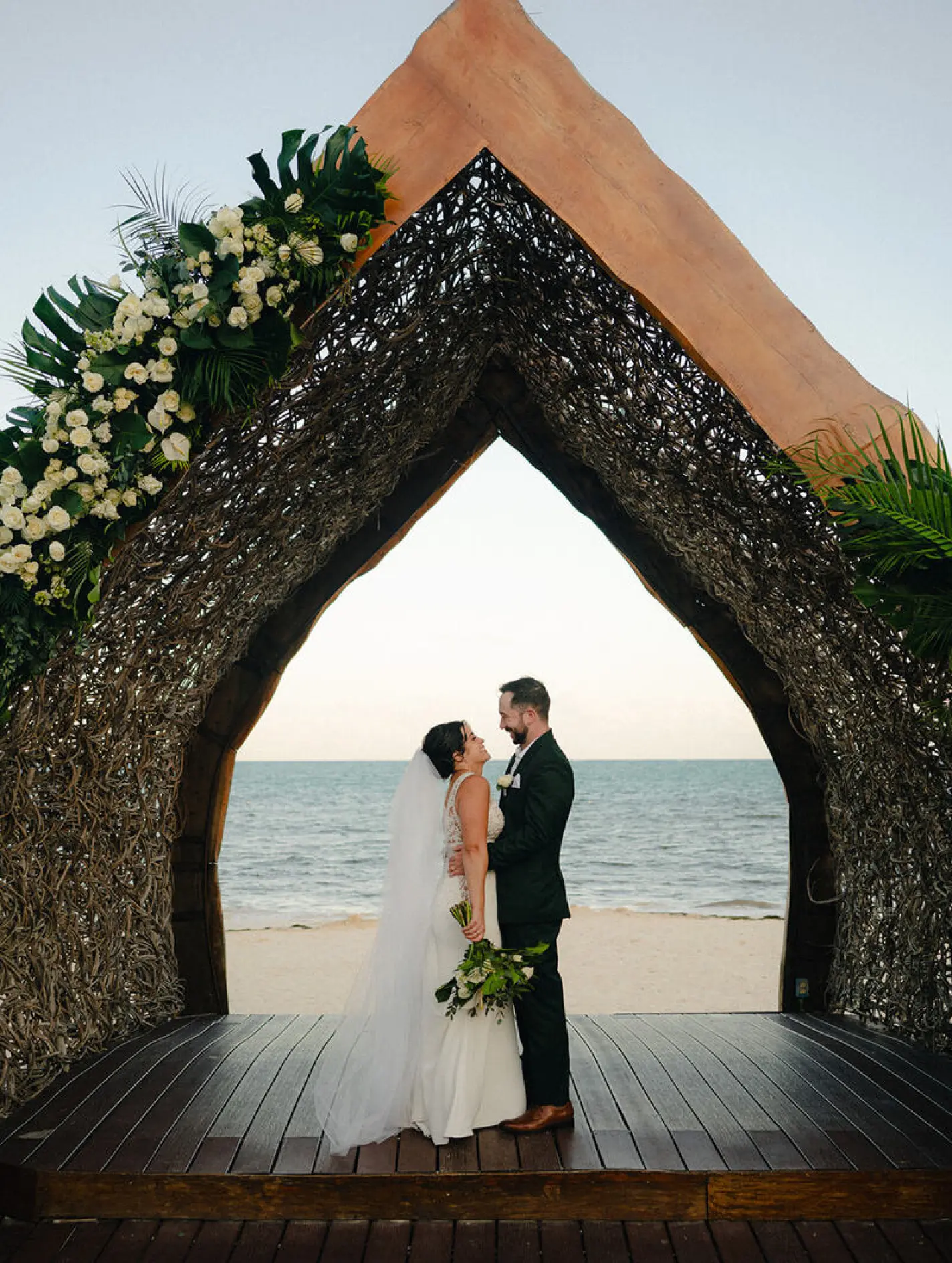 Alexis & Drew's wedding portrait under a gazebo at Dreams Natura, Riviera Maya