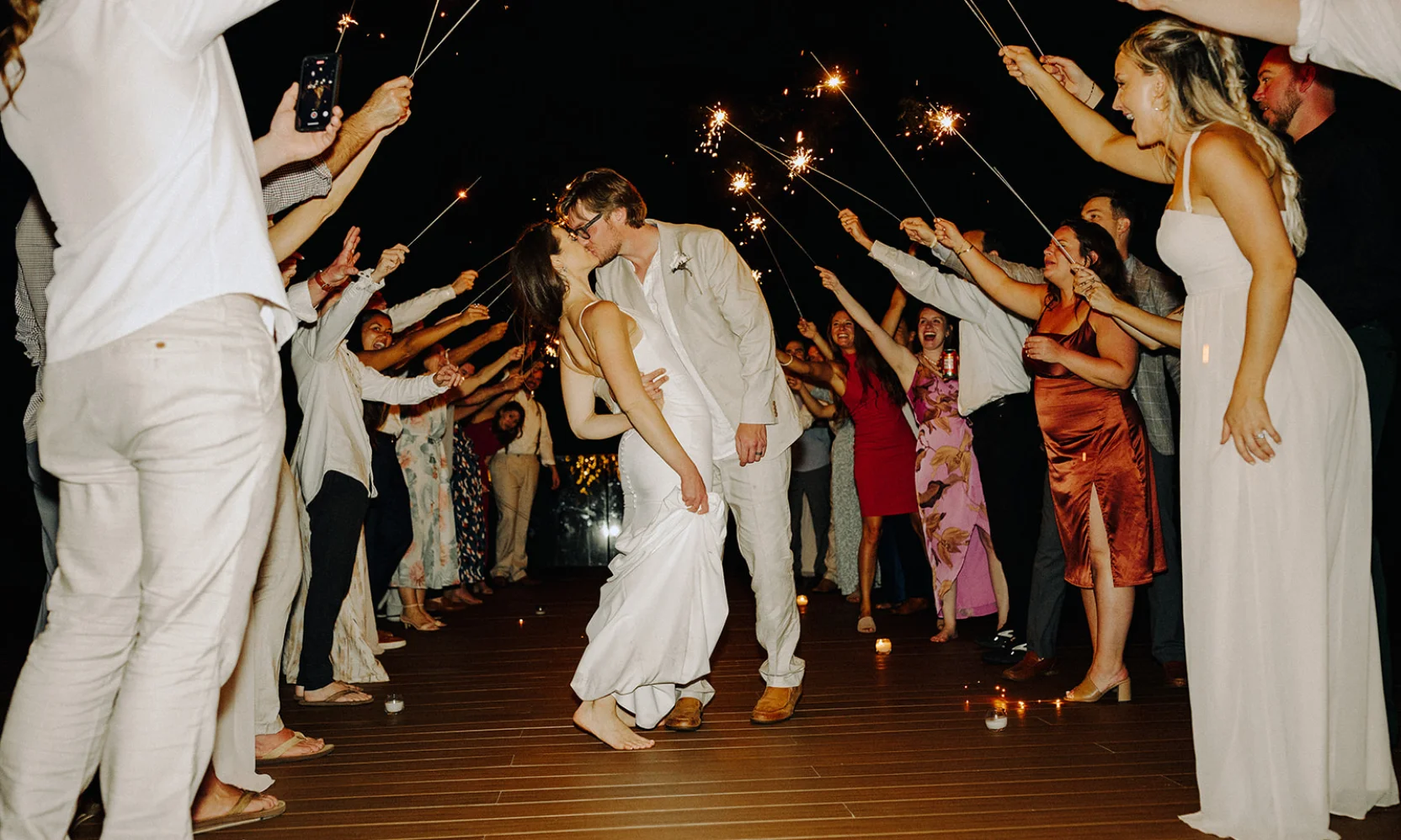 Stephanie & Austin kiss as the guests cheer