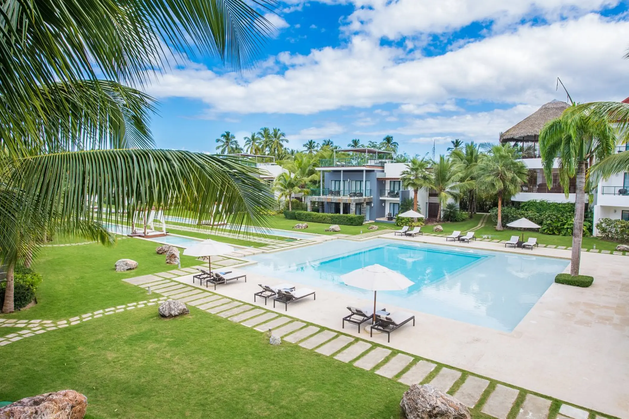 Sublime Samaná swimming pool and lounge area surrounded by tropical gardens, Samana