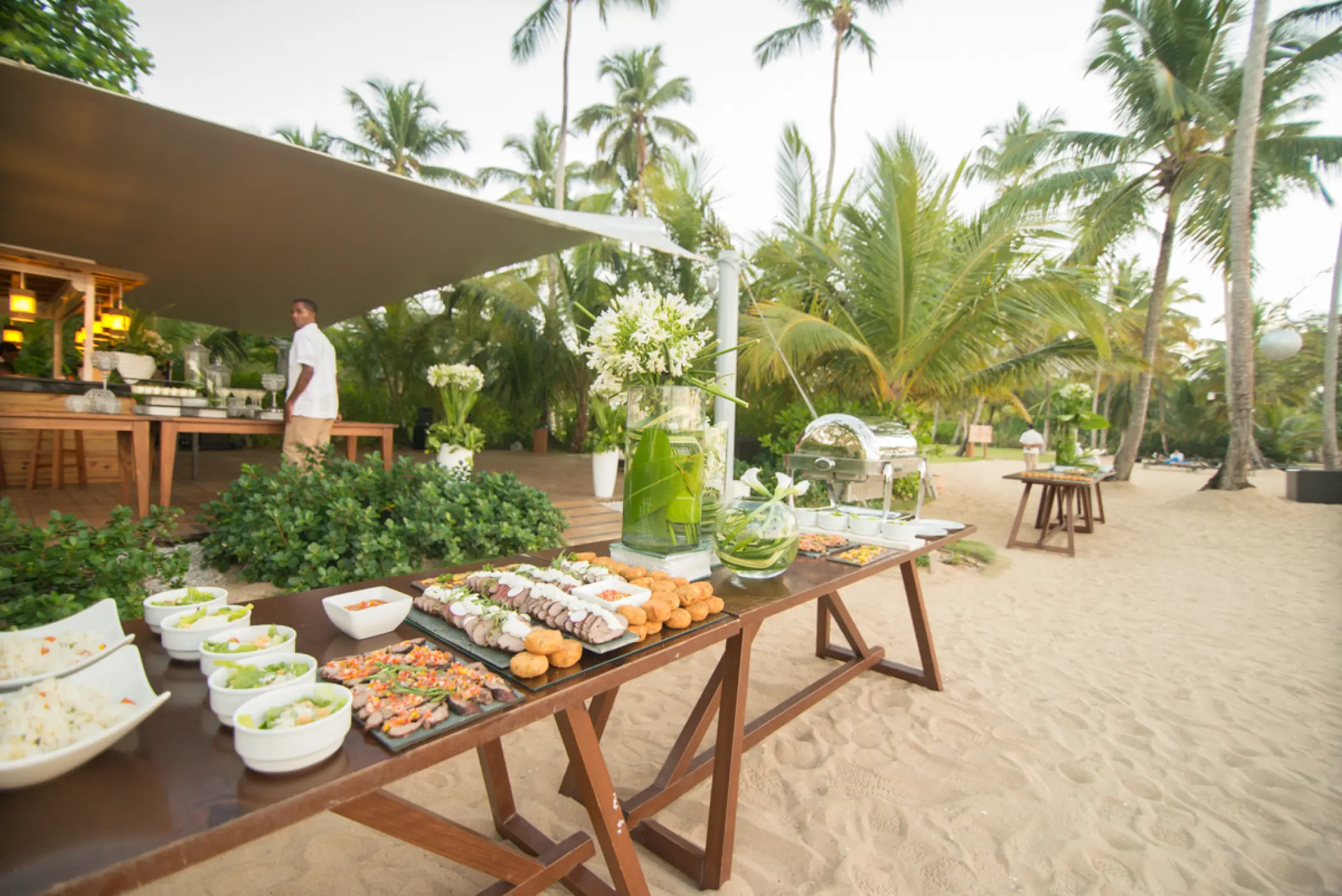 Beachfront wedding reception catering tables at Sublime Samaná, Samana