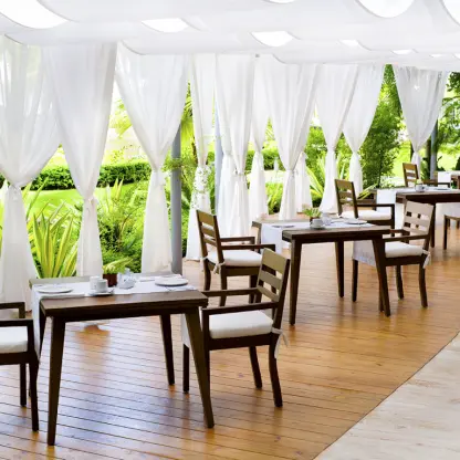 Bistro wedding reception tables under a white canopy at Sublime Samaná, Samana
