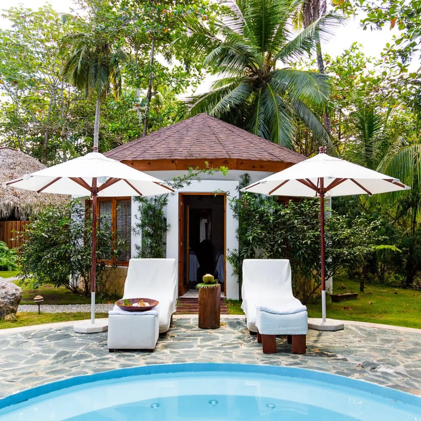 Coconut Whispers spa cabin with outdoor pool and lounge chairs at Sublime Samaná, Samana