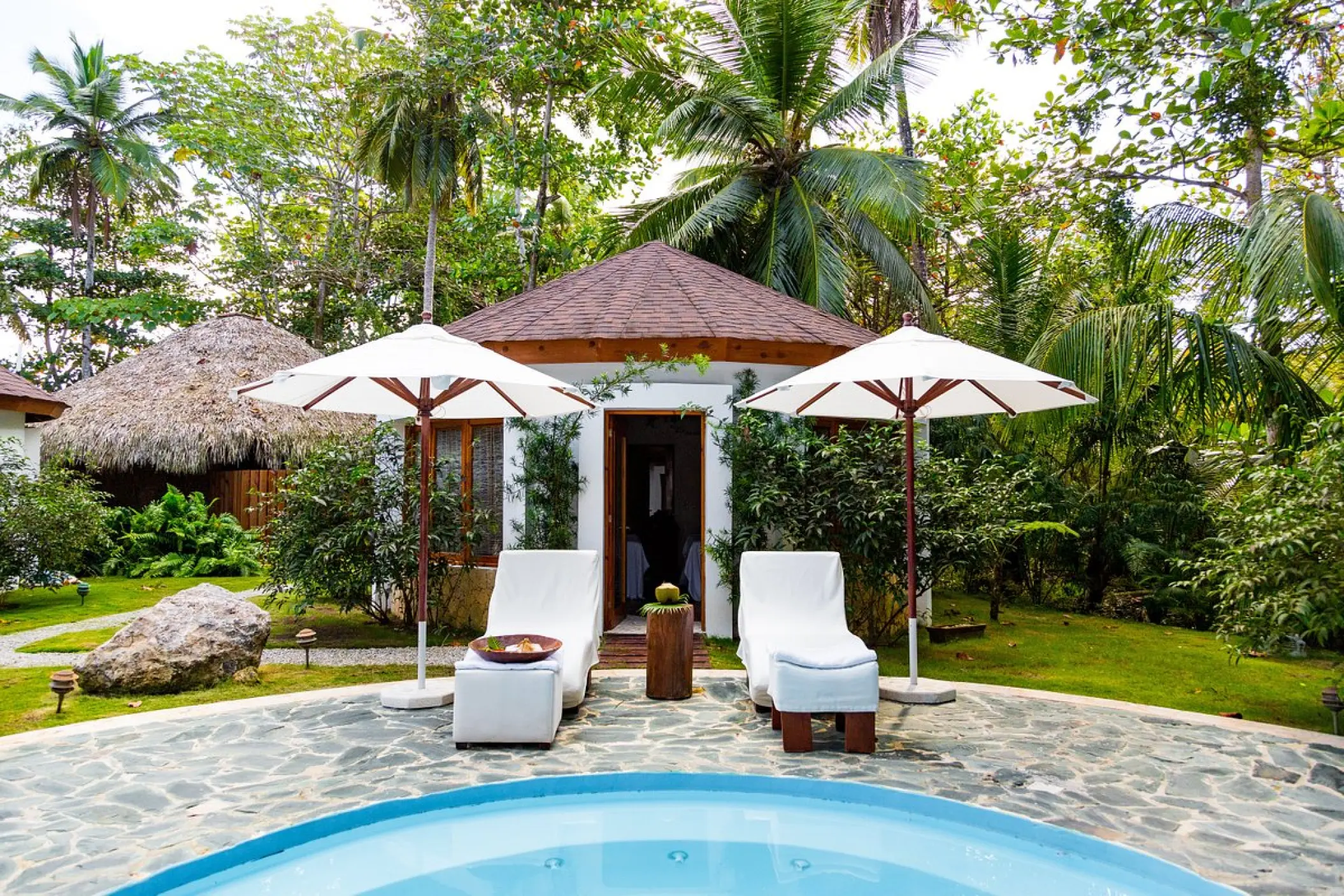 Coconut Whispers spa cabin with outdoor pool and lounge chairs at Sublime Samaná, Samana