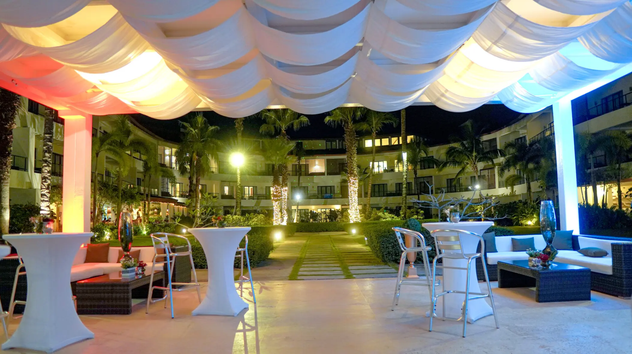Evening wedding reception under a draped canopy at Sublime Samaná, Samana