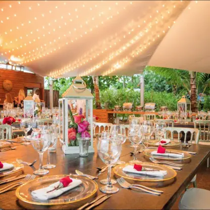 Wedding reception setup under a tent with string lights at Sublime Samaná, Samana