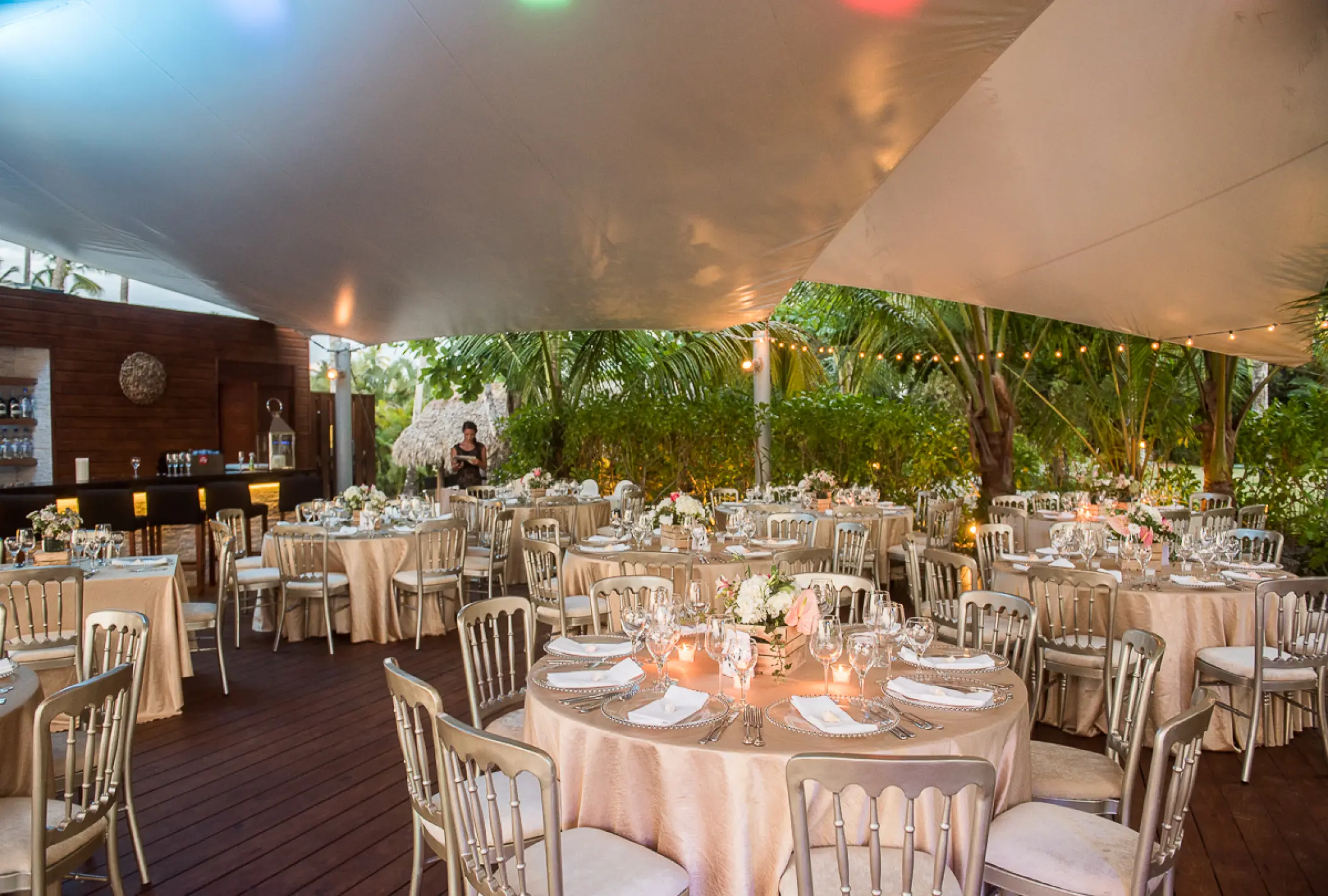 Outdoor wedding reception under a white canopy at Sublime Samaná, Samana