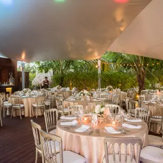 Outdoor wedding reception under a white canopy at Sublime Samaná, Samana