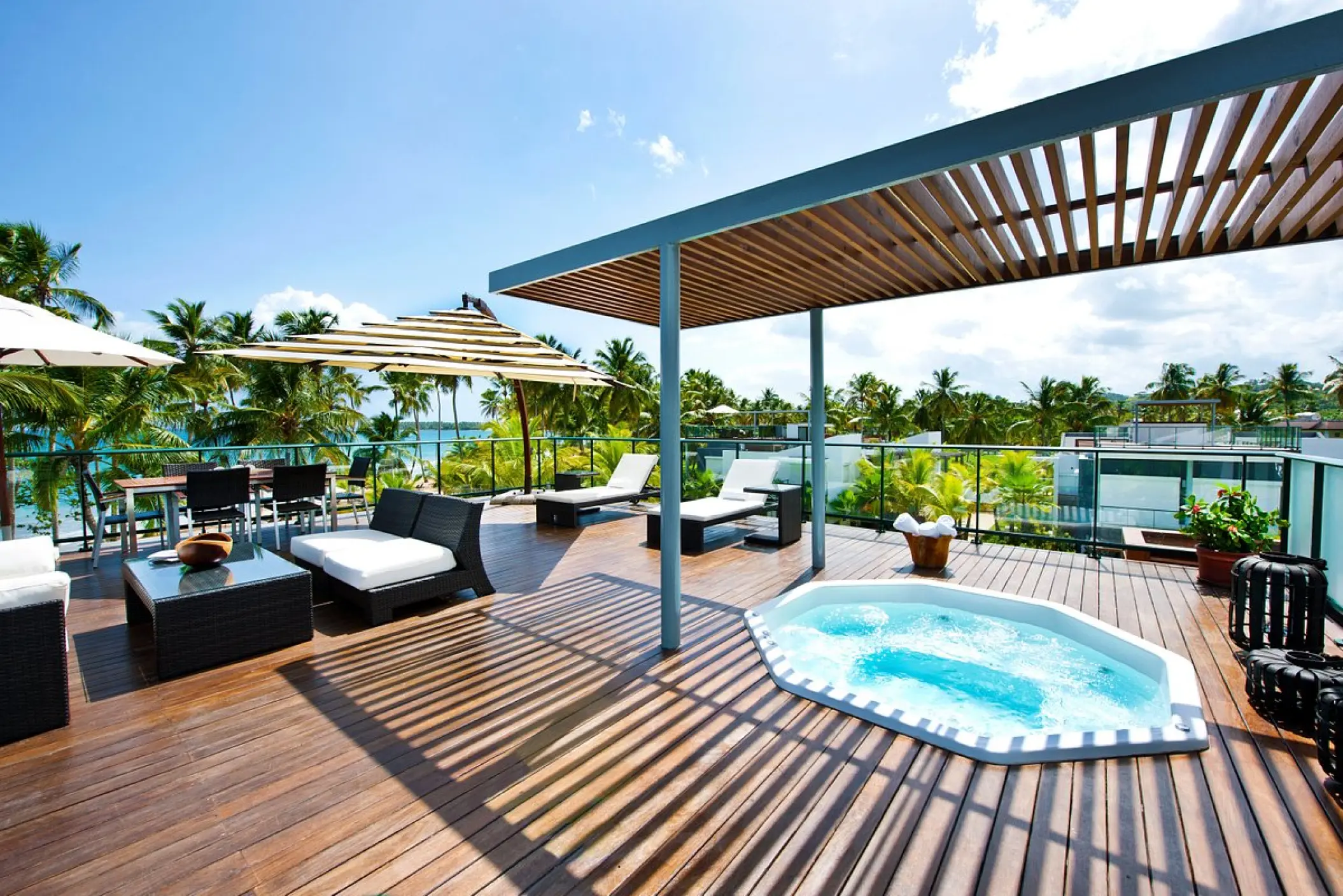 Private rooftop terrace with hot tub and lounge seating at Sublime Samaná, Samana