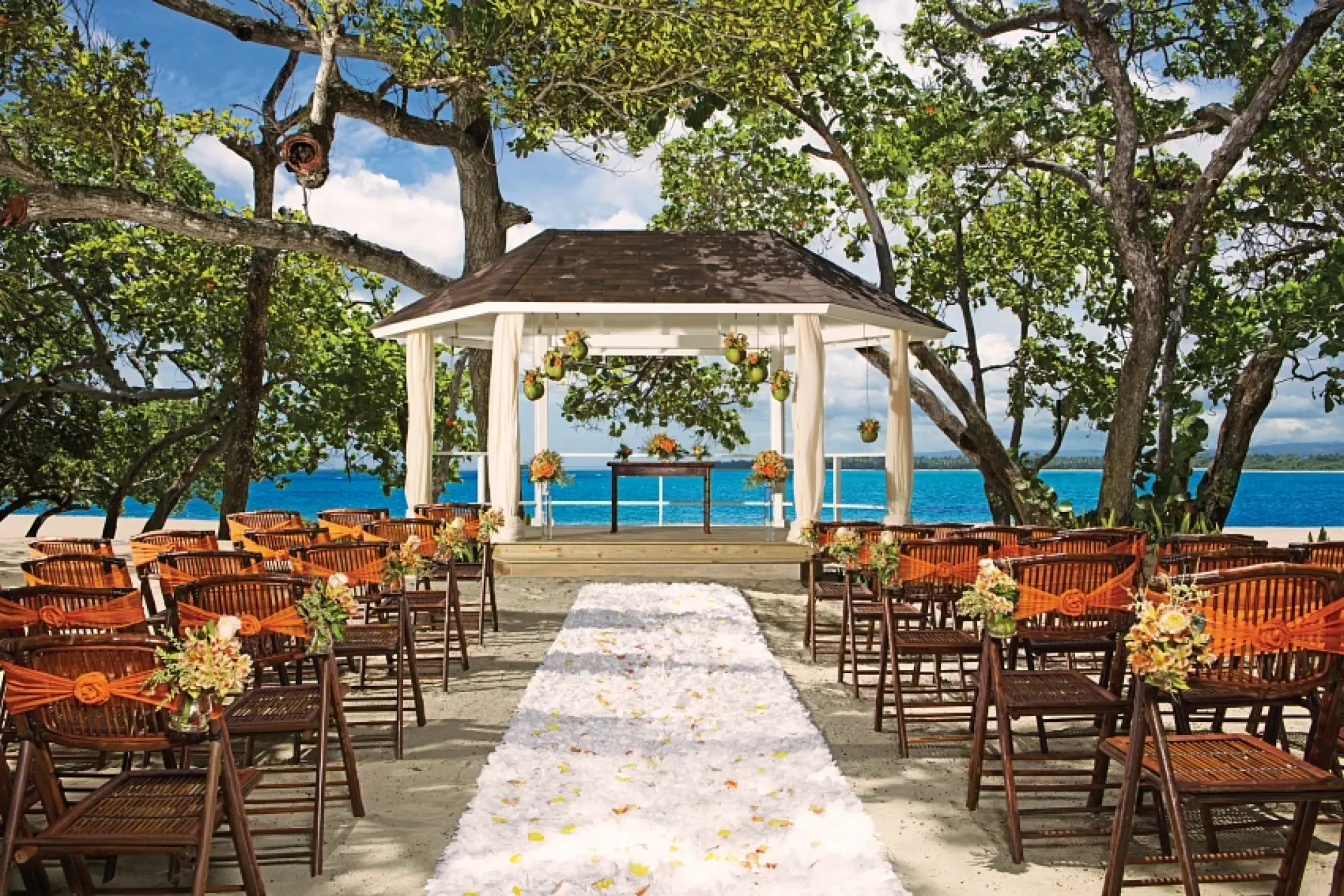 Beachfront wedding ceremony gazebo with a white petal aisle at Sunscape Akumal Beach, Tulum