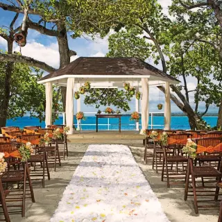 Beachfront wedding ceremony gazebo with a white petal aisle at Sunscape Akumal Beach, Tulum