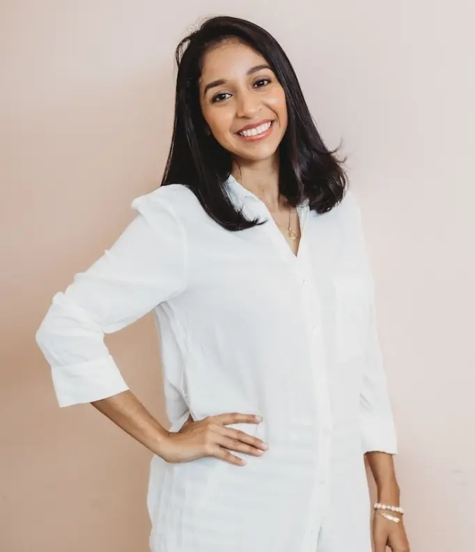Paradise Weddings planner smiling in a white shirt against a neutral background