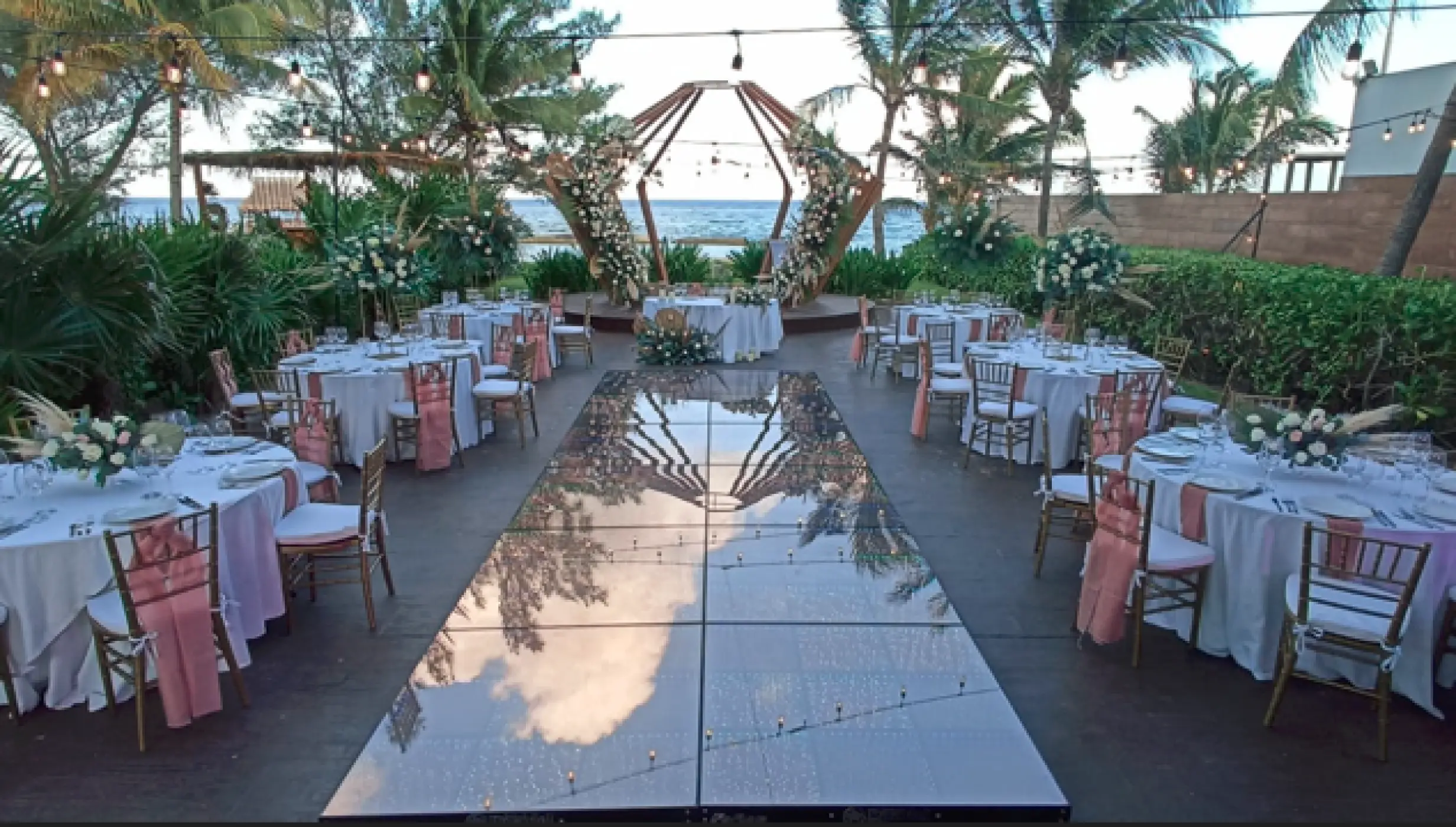Outdoor wedding reception with a mirror dance floor at The Fives Beach Hotel, Playa Del Carmen