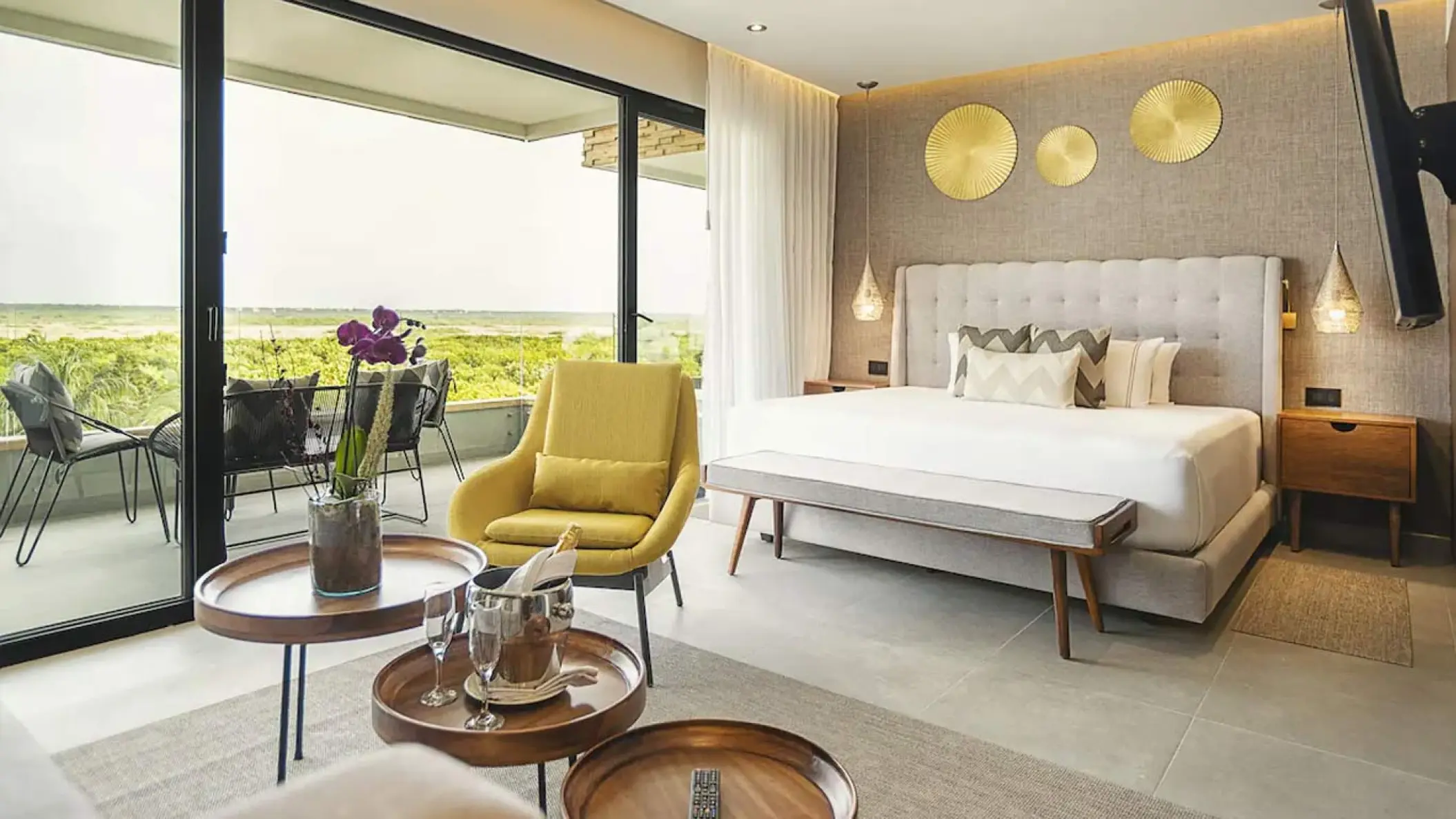 The Fives Oceanfront residential suite with balcony overlooking lush greenery, Riviera Maya