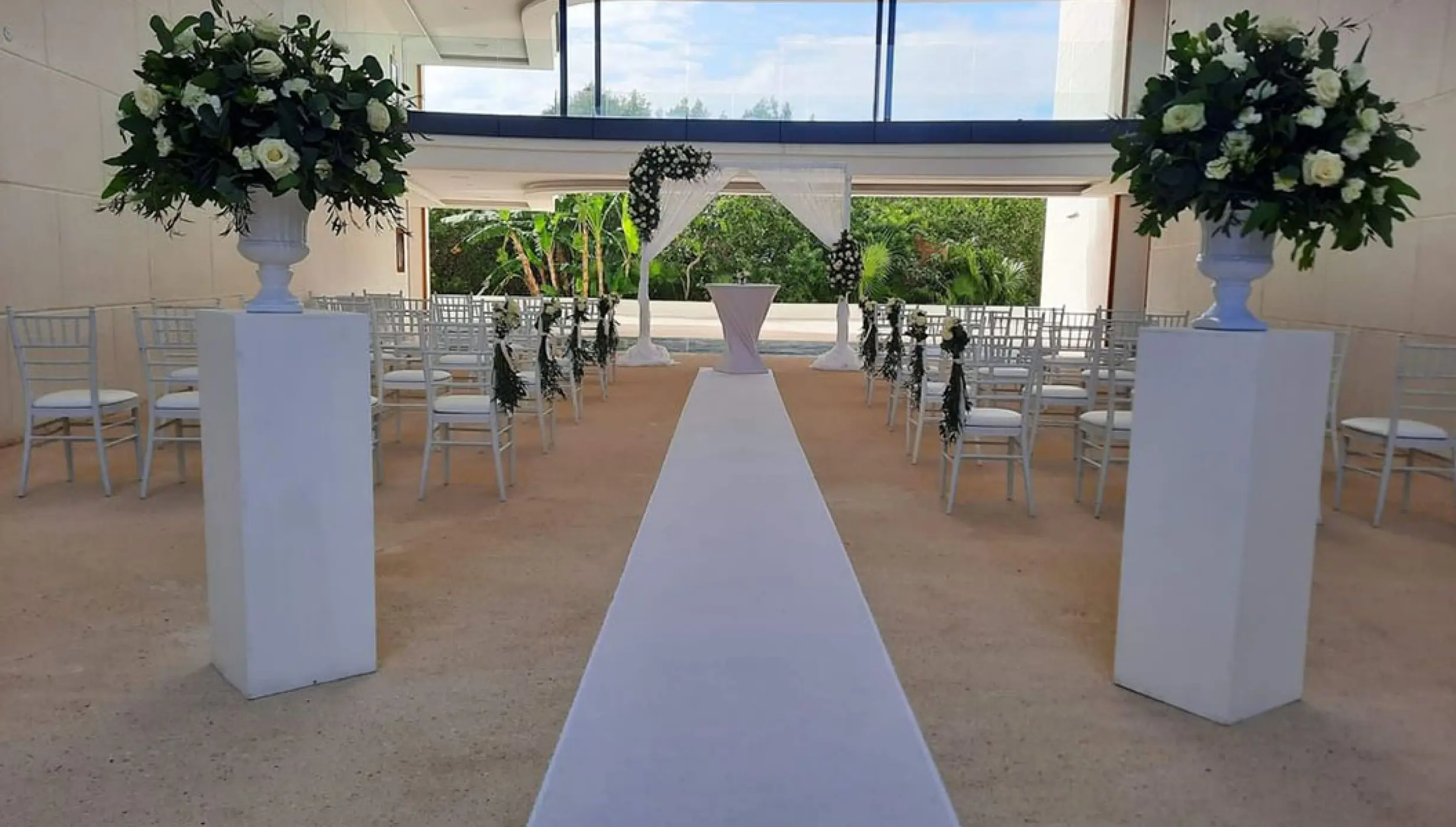 Ceremony setup on The H Arch venue at Haven Riviera Cancun Resort.