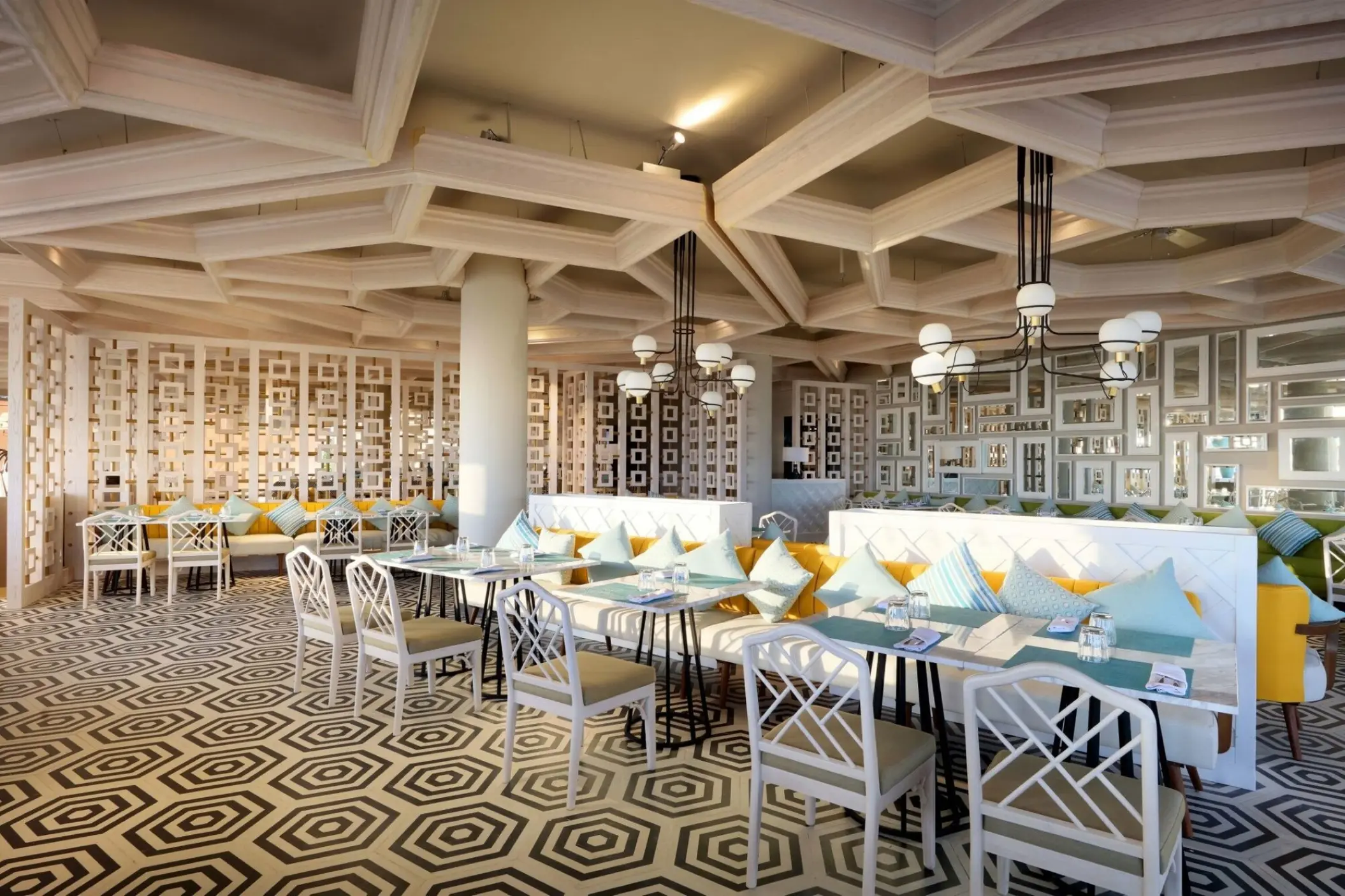 Helios Beach Club restaurant with geometric tiled floors and coffered ceiling at TRS Coral Hotel, Cancun