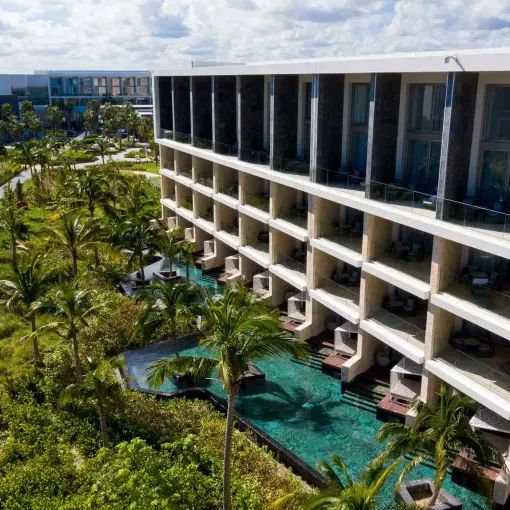 TRS Coral Hotel swim-up pools and suites surrounded by gardens, Cancun