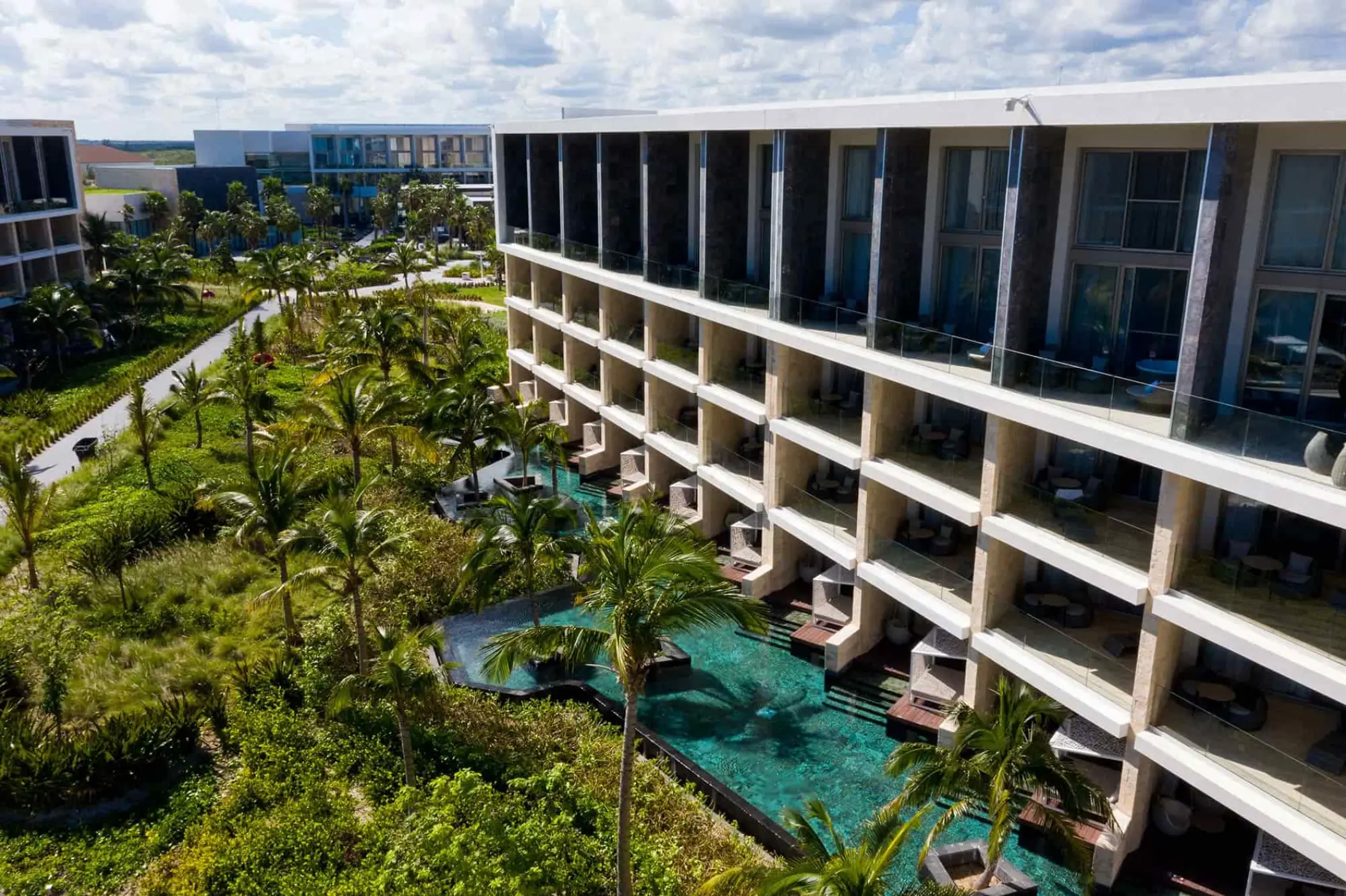 TRS Coral Hotel swim-up pools and suites surrounded by gardens, Cancun