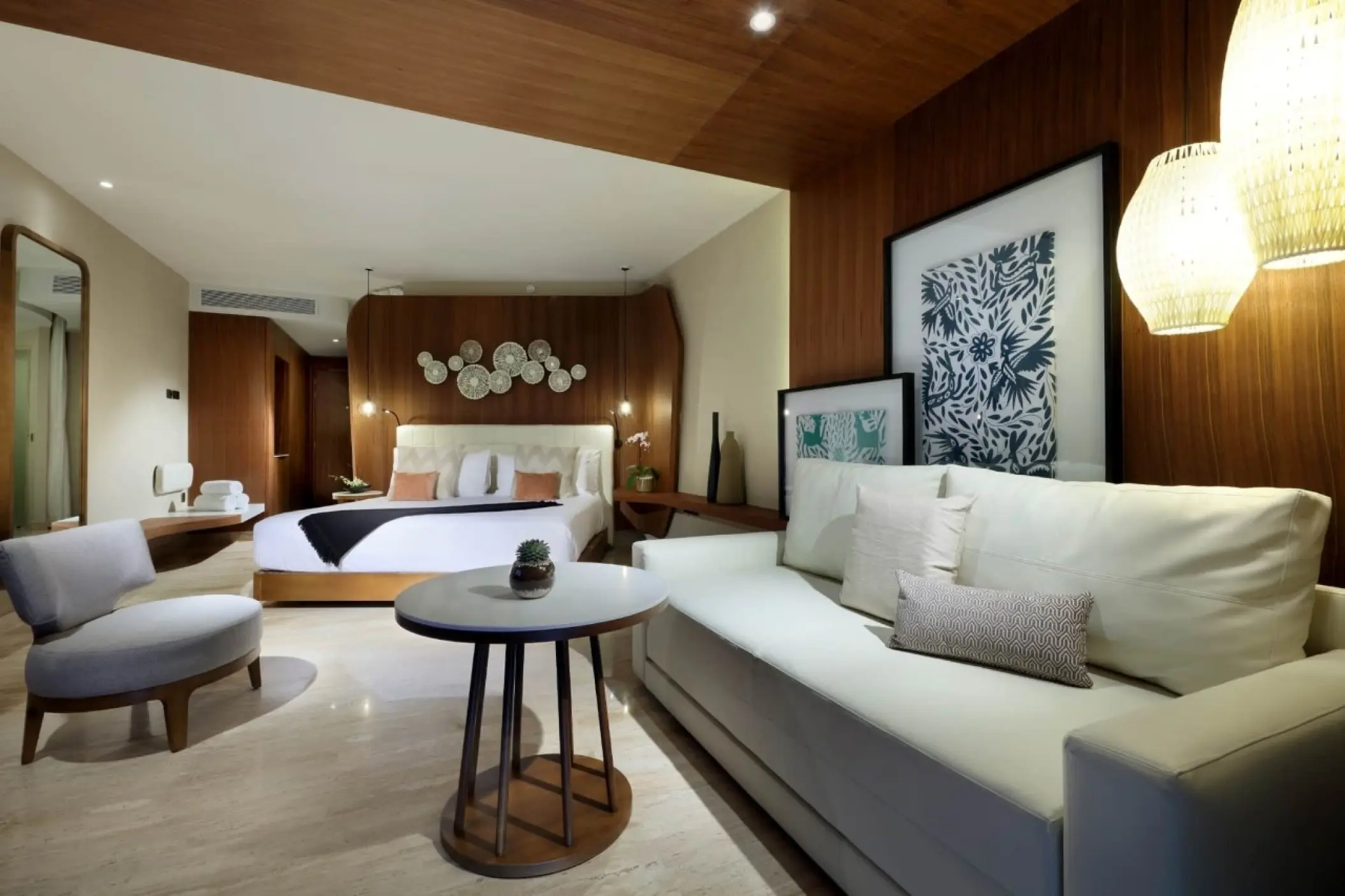 Junior Suite Oceanview with modern seating area and wood paneling at TRS Coral Hotel, Cancun