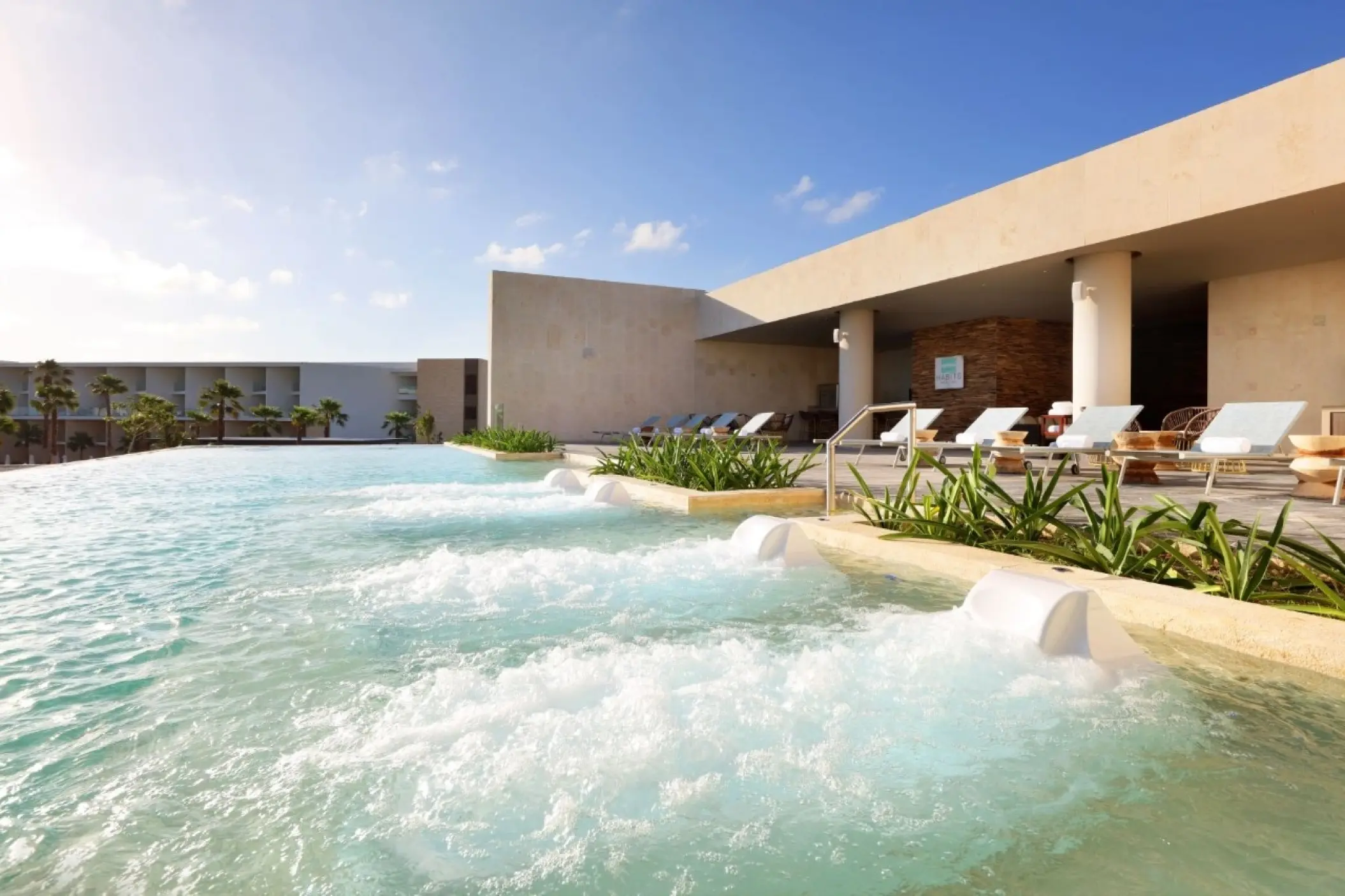Hydrotherapy circuit pool with lounge chairs at TRS Coral Hotel, Cancun