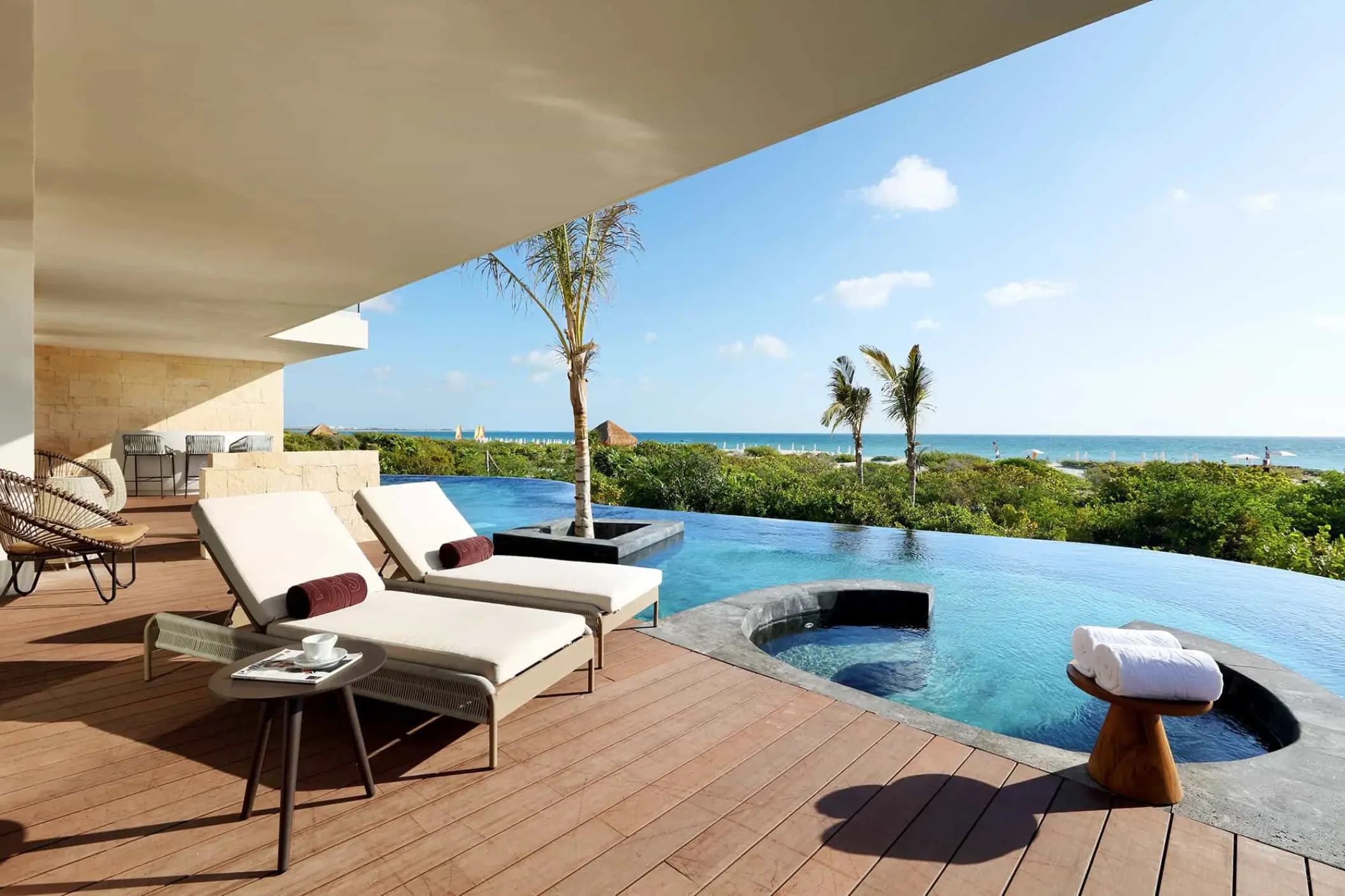 TRS Coral Hotel swim-up signature suite terrace with private pool and lounge chairs, Cancun