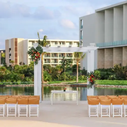 Waterfront wedding ceremony setup at TRS Coral Hotel, Cancun