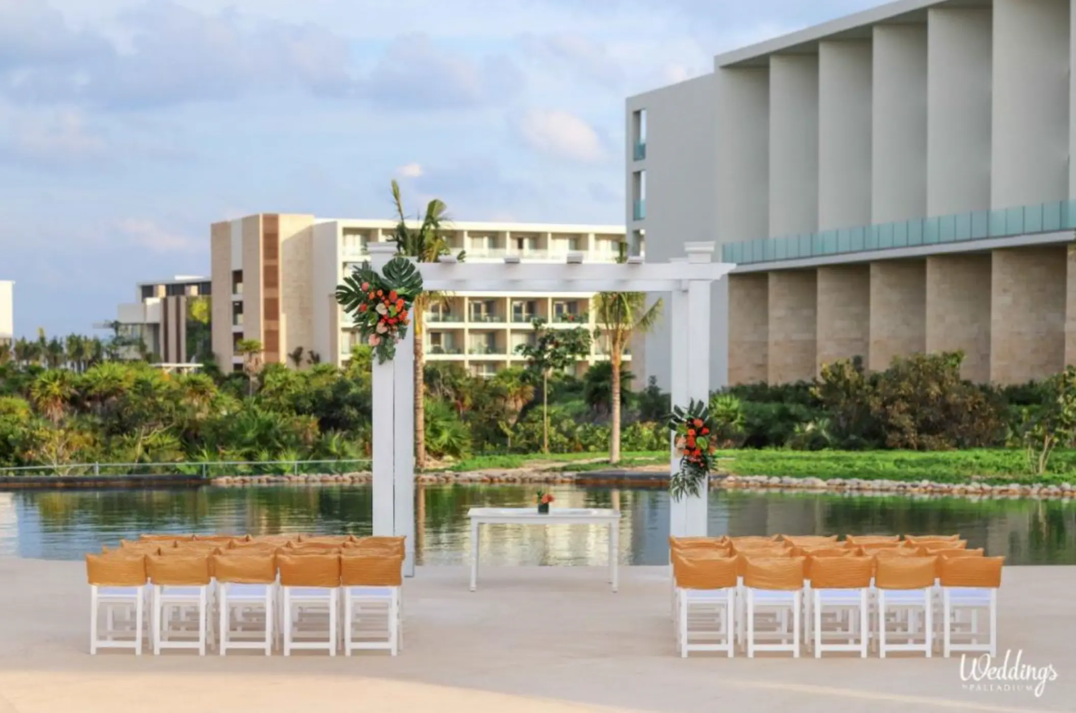 Waterfront wedding ceremony setup at TRS Coral Hotel, Cancun