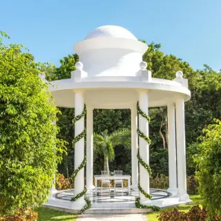 White garden gazebo wedding ceremony setup at TRS Coral Hotel, Cancun
