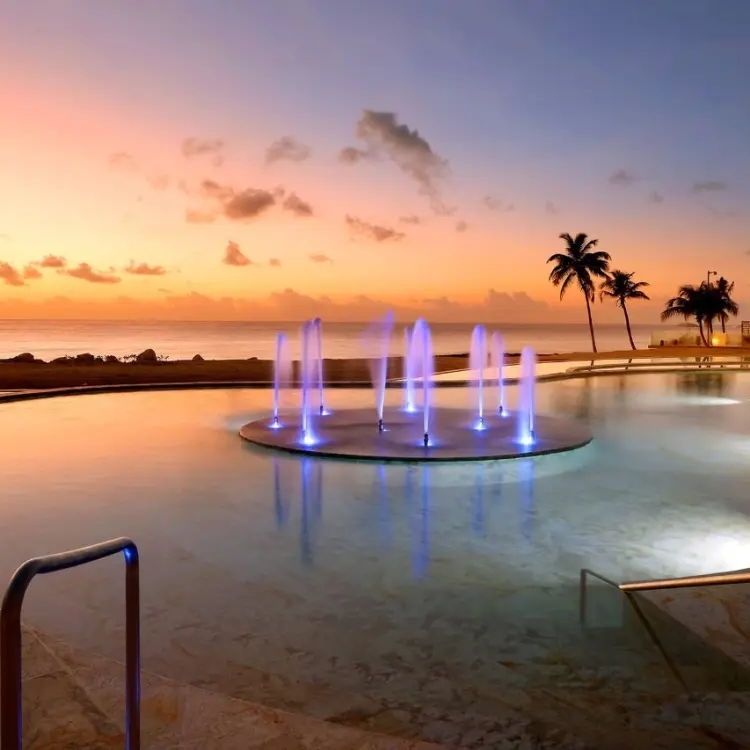 TRS Yucatan illuminated pool fountain at sunset, Riviera Maya