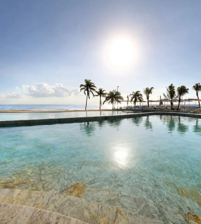 Tiered infinity pool overlooking the ocean at TRS Yucatan, Riviera Maya