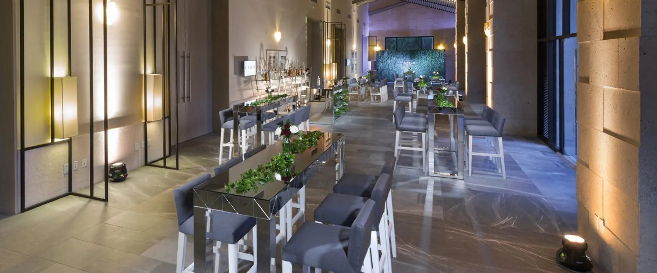 Modern foyer reception lounge with high-top tables and bar stools at UNICO 20°87°, Riviera Maya