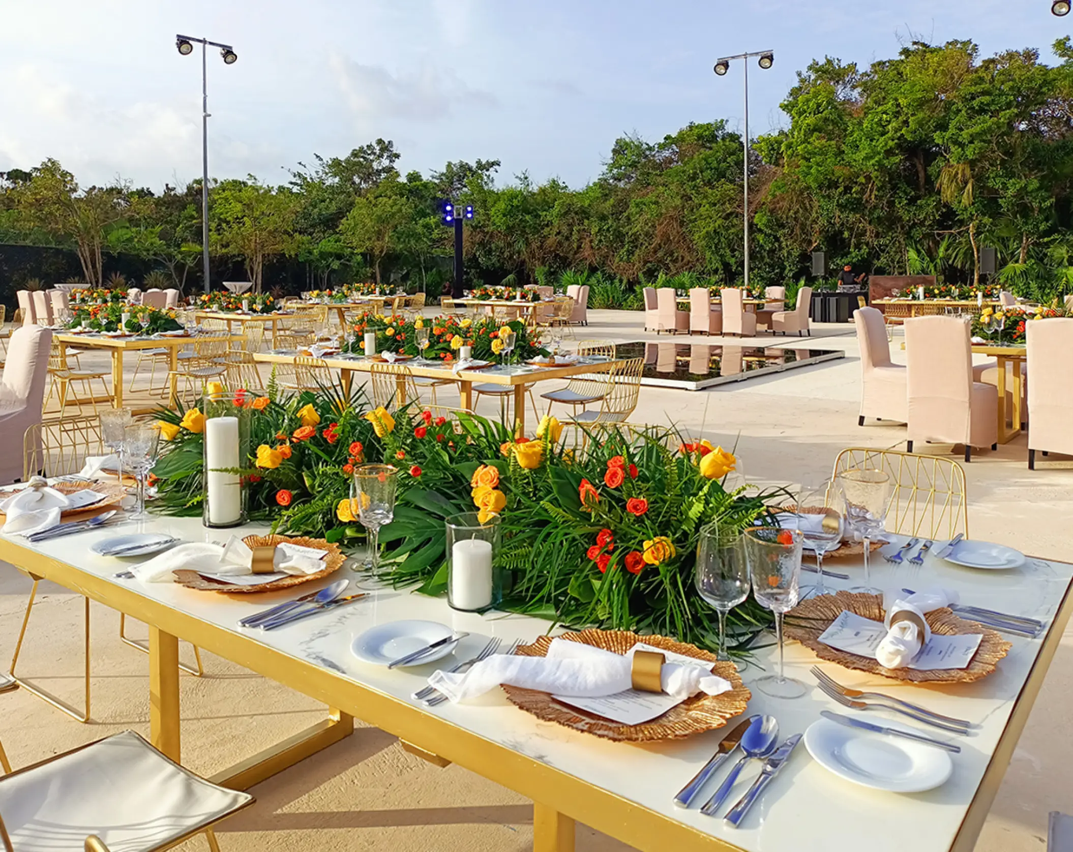 Terraza Verde wedding reception with yellow floral runners at UNICO 20°87°, Riviera Maya