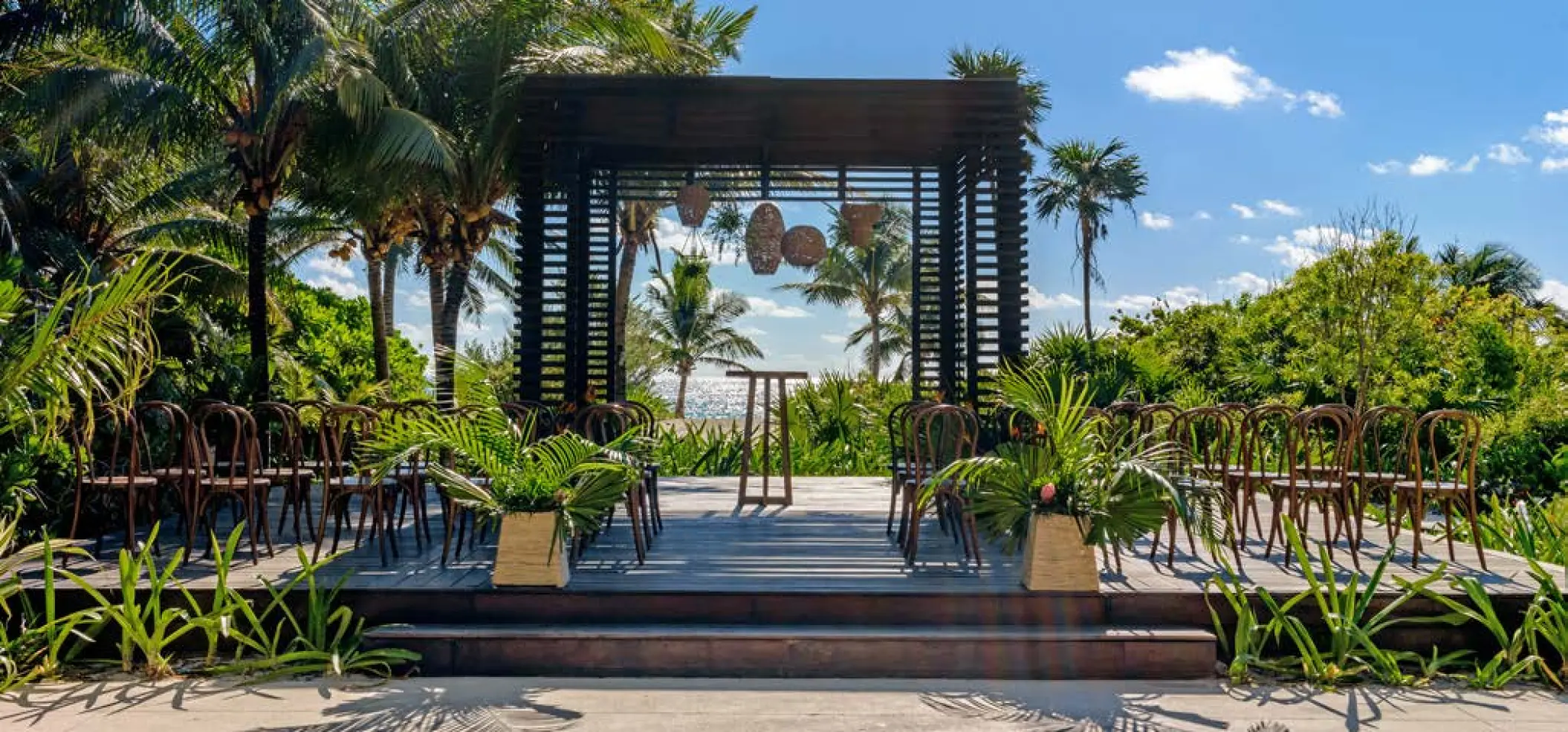 Wooden gazebo wedding ceremony setup at UNICO 20°87°, Riviera Maya