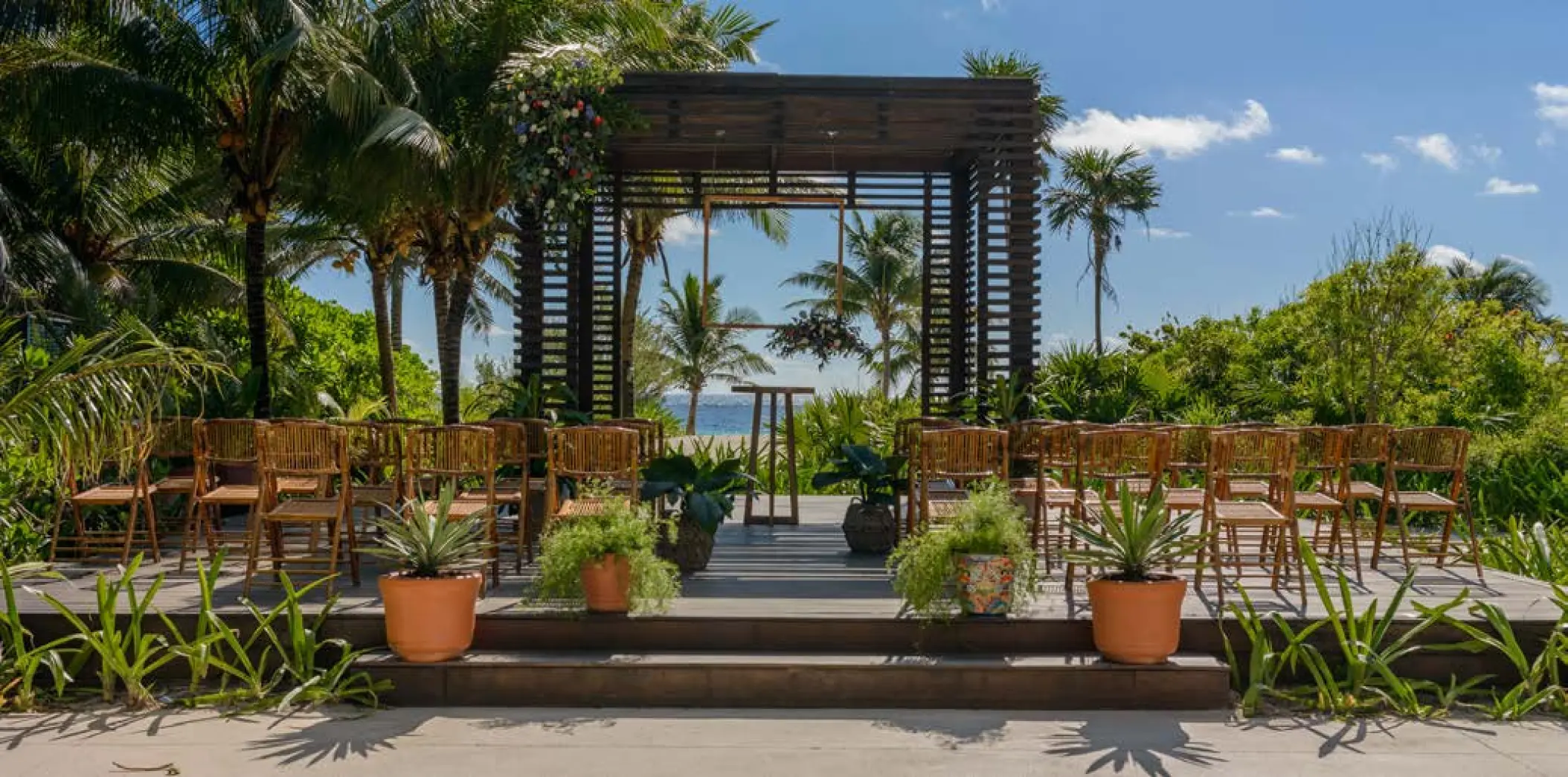 Wooden gazebo wedding ceremony setup with ocean views at UNICO 20°87°, Riviera Maya
