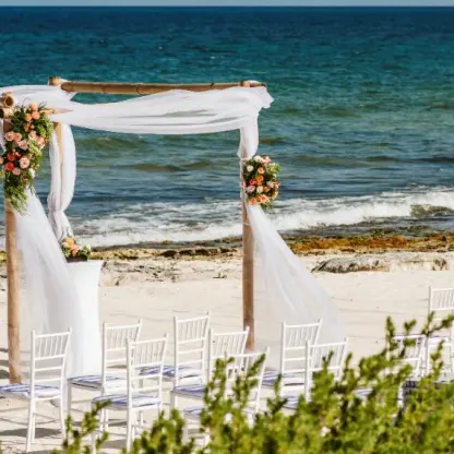 Beachfront wedding ceremony with white gazebo at Valentin Imperial, Riviera Maya
