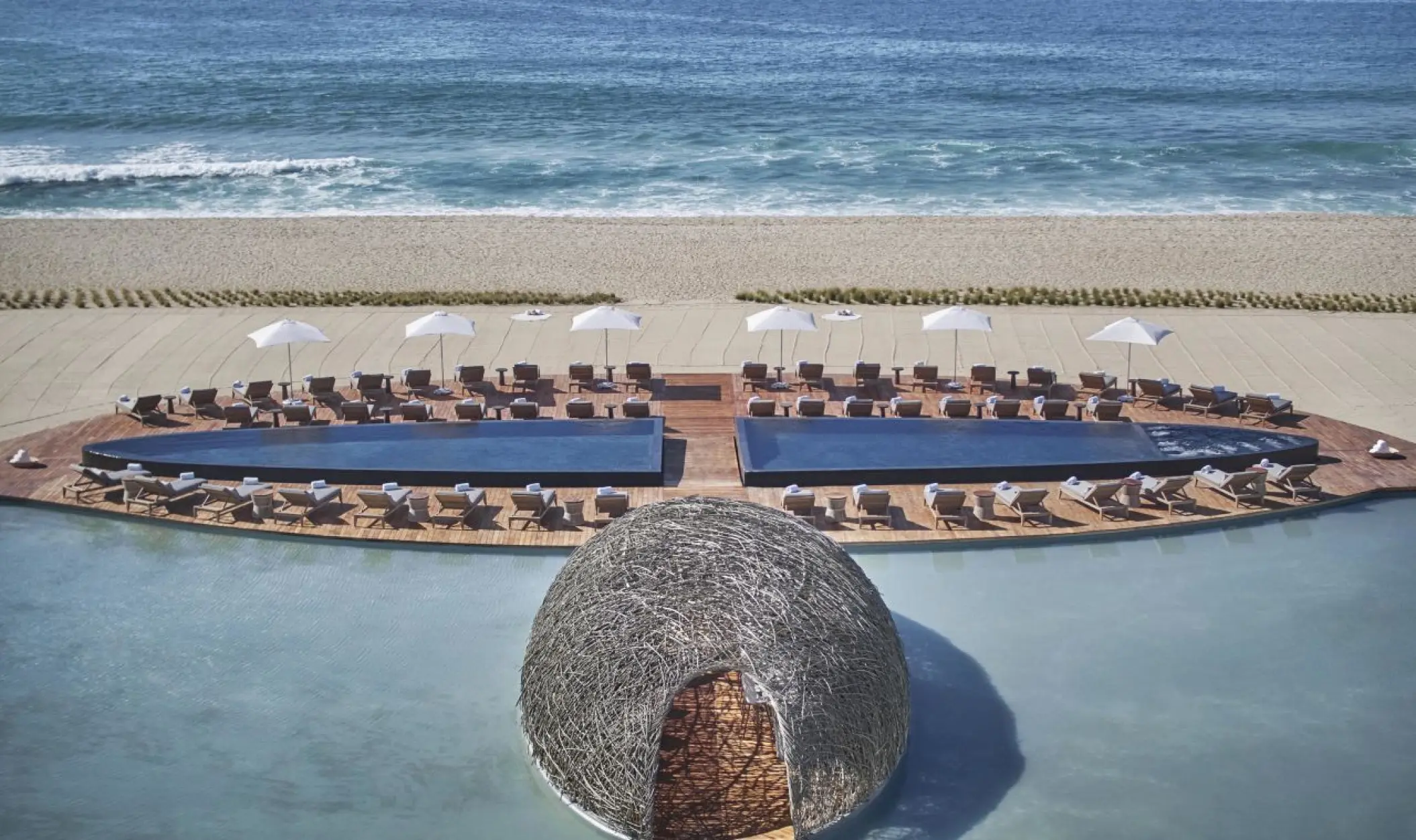 Beachfront deck and modern nest structure at Viceroy Los Cabos, Cabo San Lucas