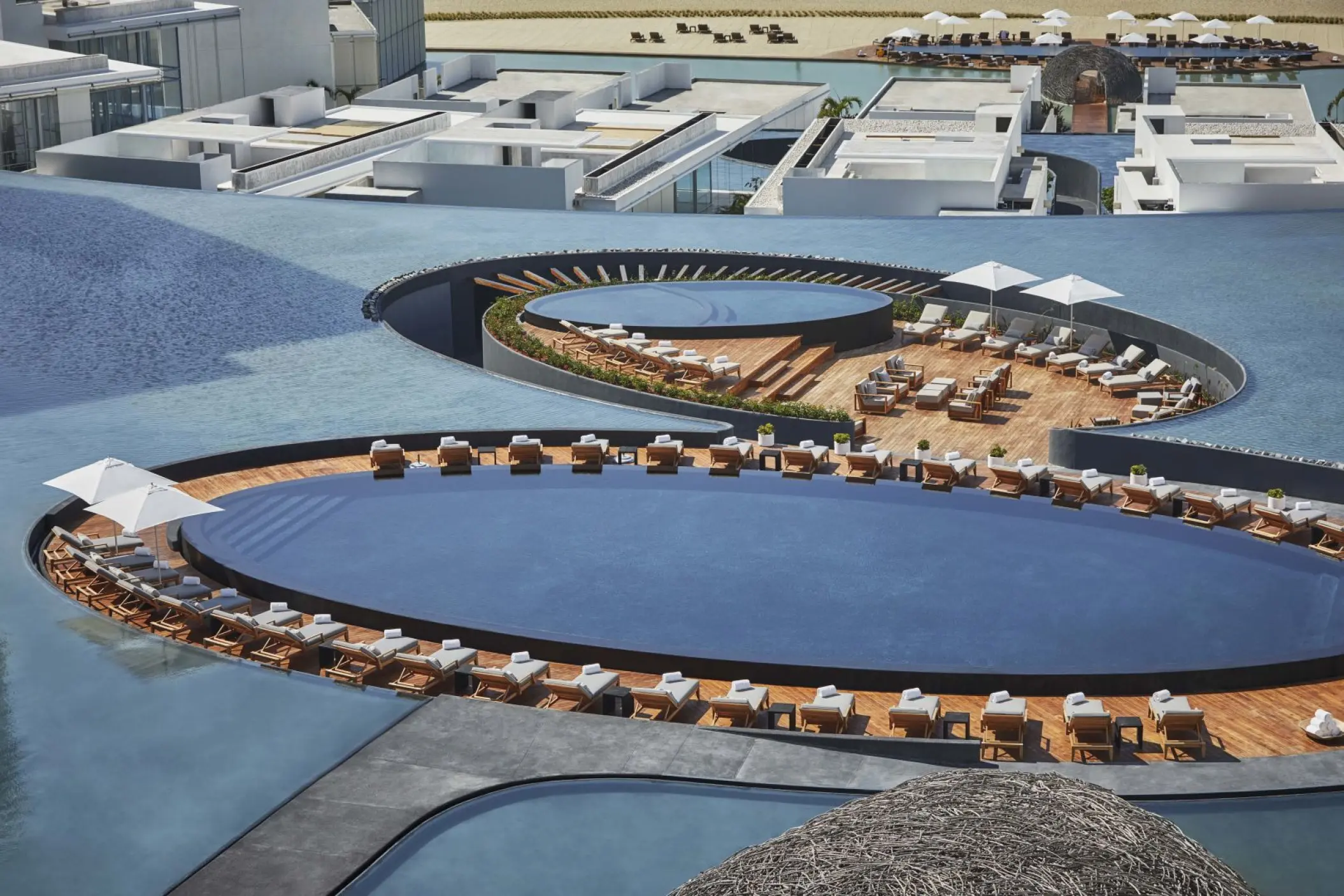 Aerial view of circular pools and modern architecture at Viceroy Los Cabos, Cabo San Lucas