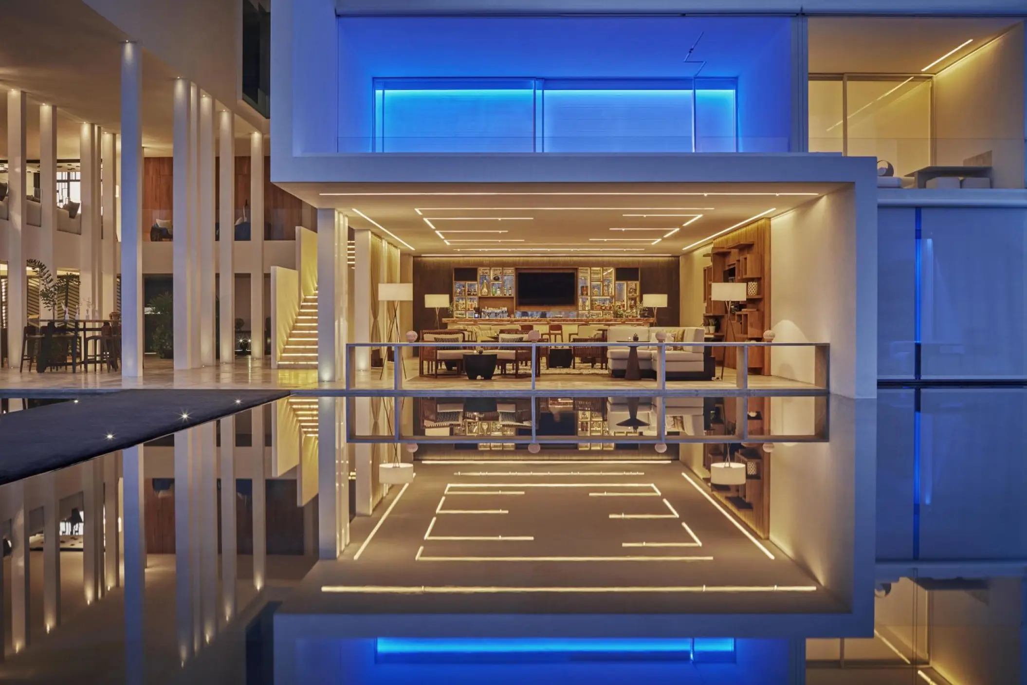 Modern architecture of Otro Bar reflected in water at Viceroy Los Cabos, Cabo San Lucas