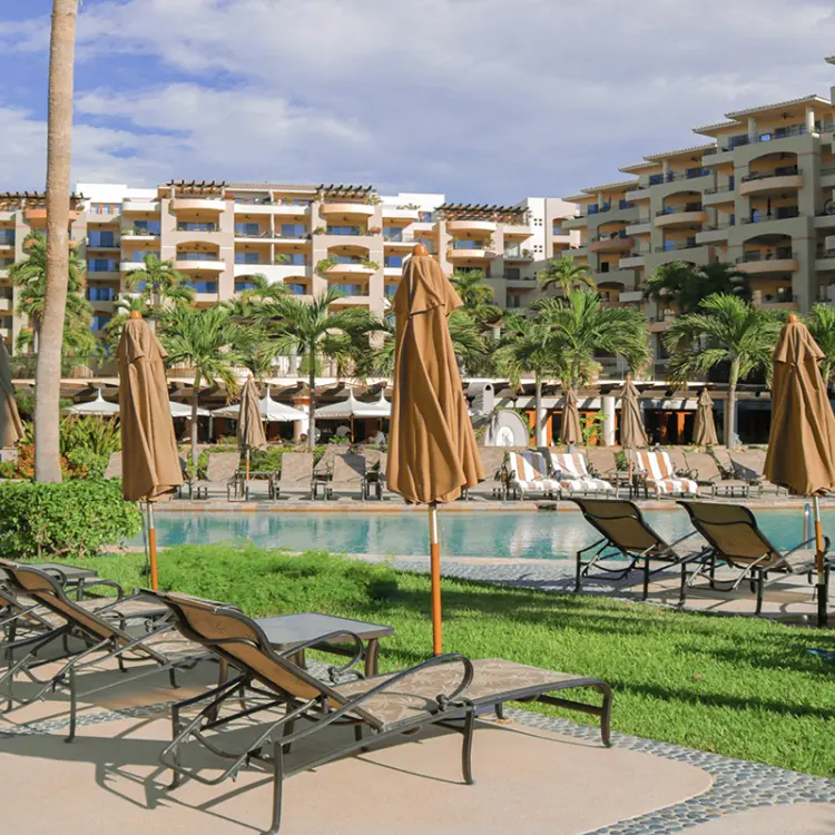 Sun loungers and umbrellas beside the swimming pool at Villa La Estancia Los Cabos, Cabo San Lucas