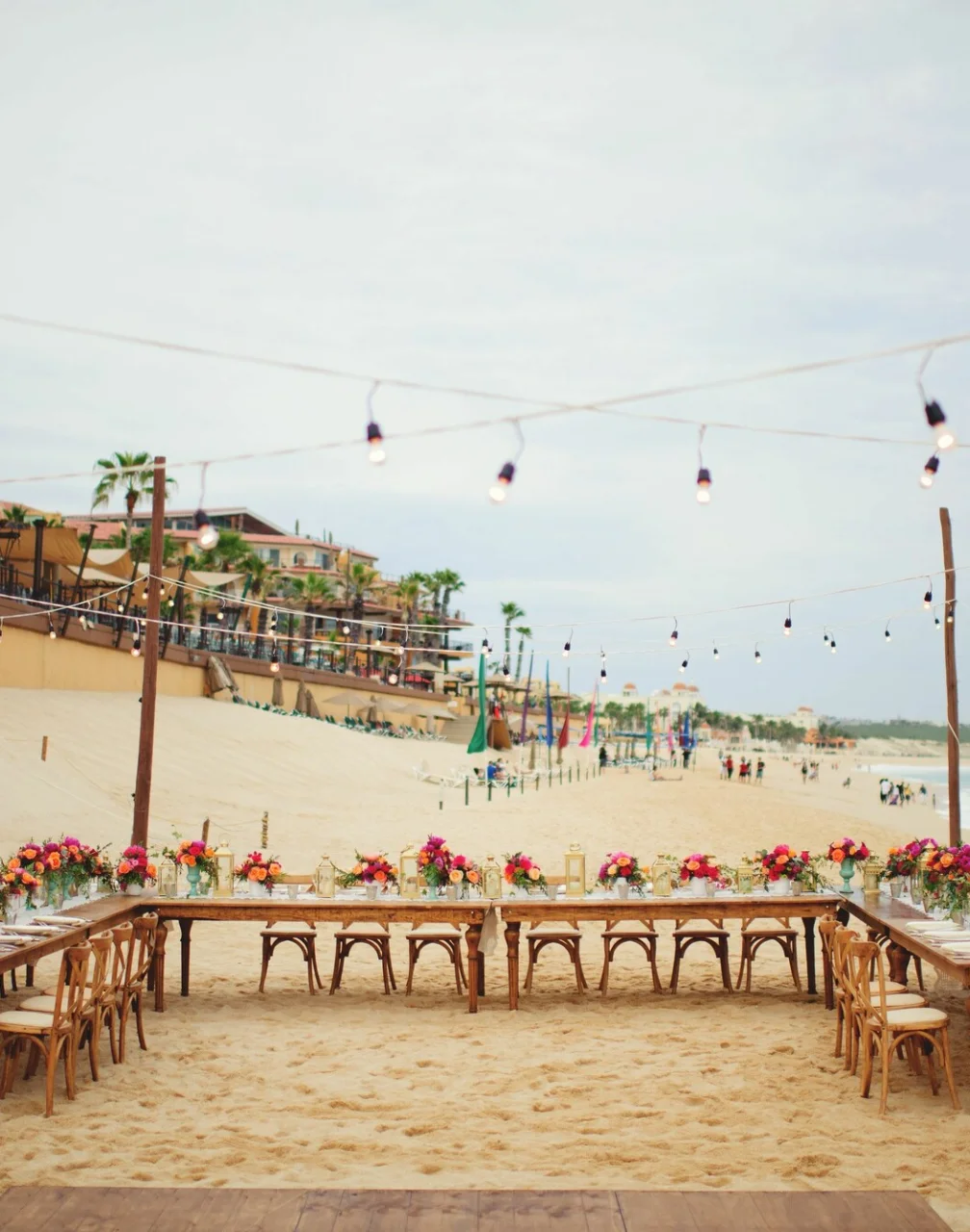 Dinner reception decor on the beach wedding venue at Villa La Estancia Los Cabos