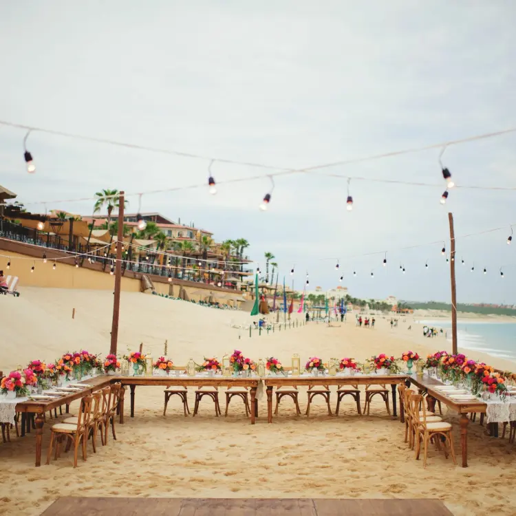 Beachfront wedding reception setup with string lights at Villa La Estancia, Cabo San Lucas