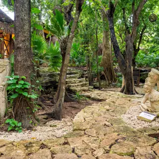 Stone statues along a jungle pathway at Viva Maya by Wyndham, Playa Del Carmen