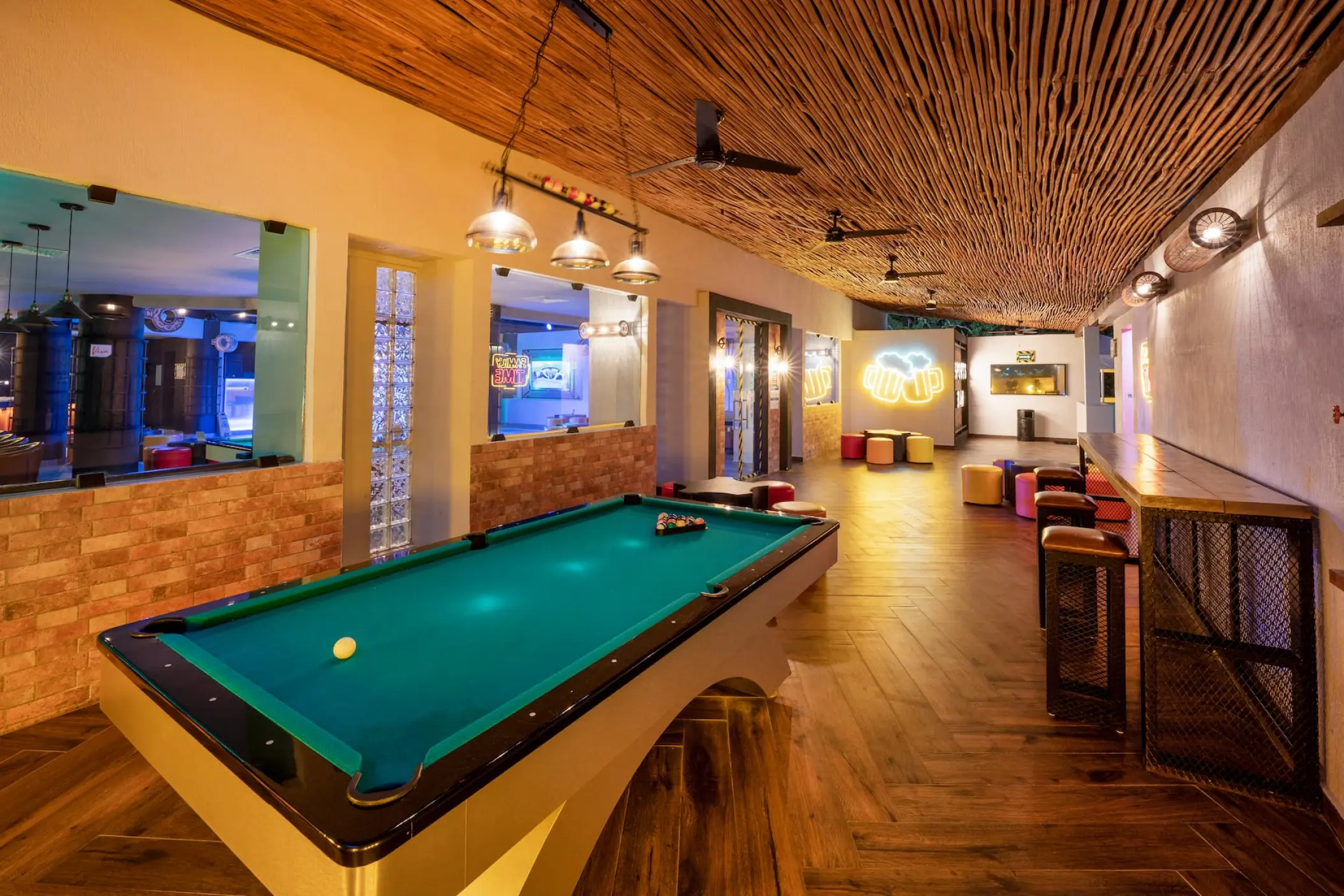 Game room with a pool table and wood-textured ceiling at Viva Maya by Wyndham, Playa Del Carmen