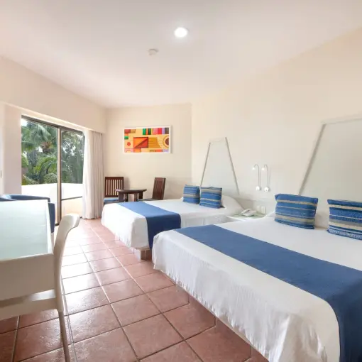 Modern double guest room with blue accents at Viva Maya by Wyndham, Playa Del Carmen
