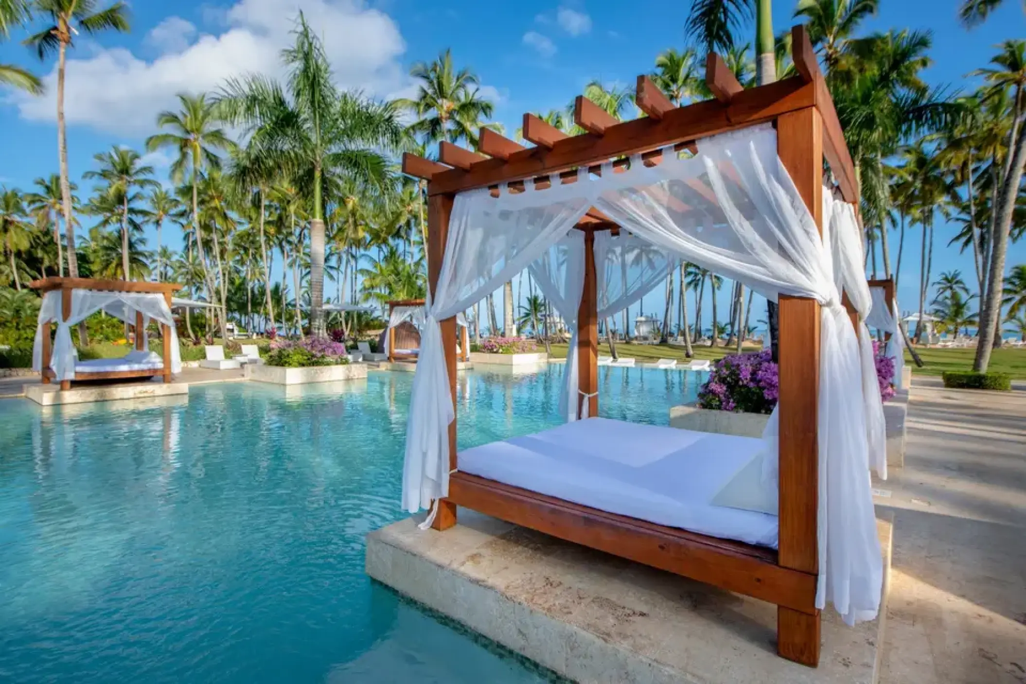 Poolside bali bed with white curtains at Viva V Samana, Samana