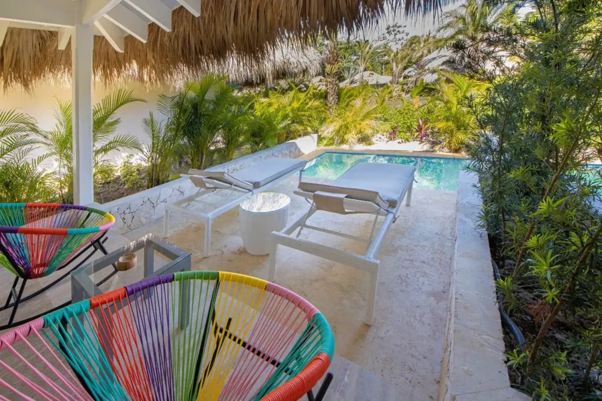Private bungalow terrace with plunge pool and lounge chairs at Viva V Samana, Samana